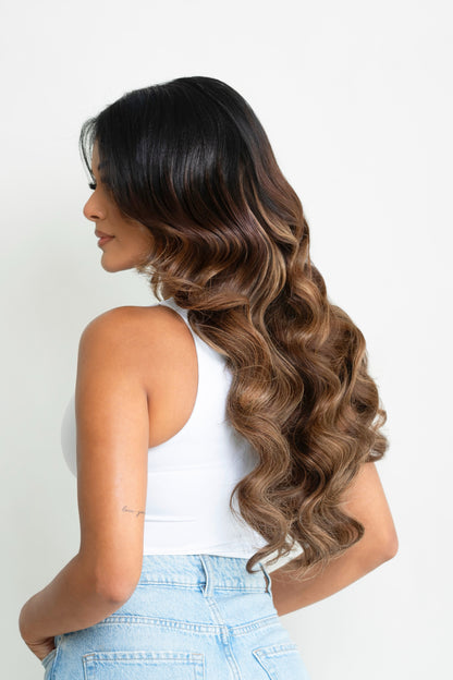 Woman wearing 20 inch dark balayage hair extensions side view