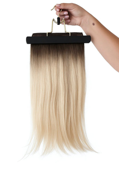 Woman wearing 20 inch blonde balayage hair extensions side view